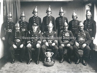 94.2444.1 Fire Brigade members with challenge cup at fire brigade headquarters in Parkside