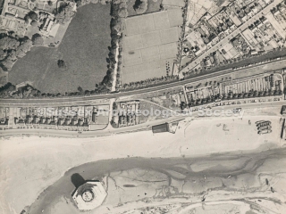 z94.2574.5 Aerial view of the harbour, Kingston and residential streets. One mystery tower